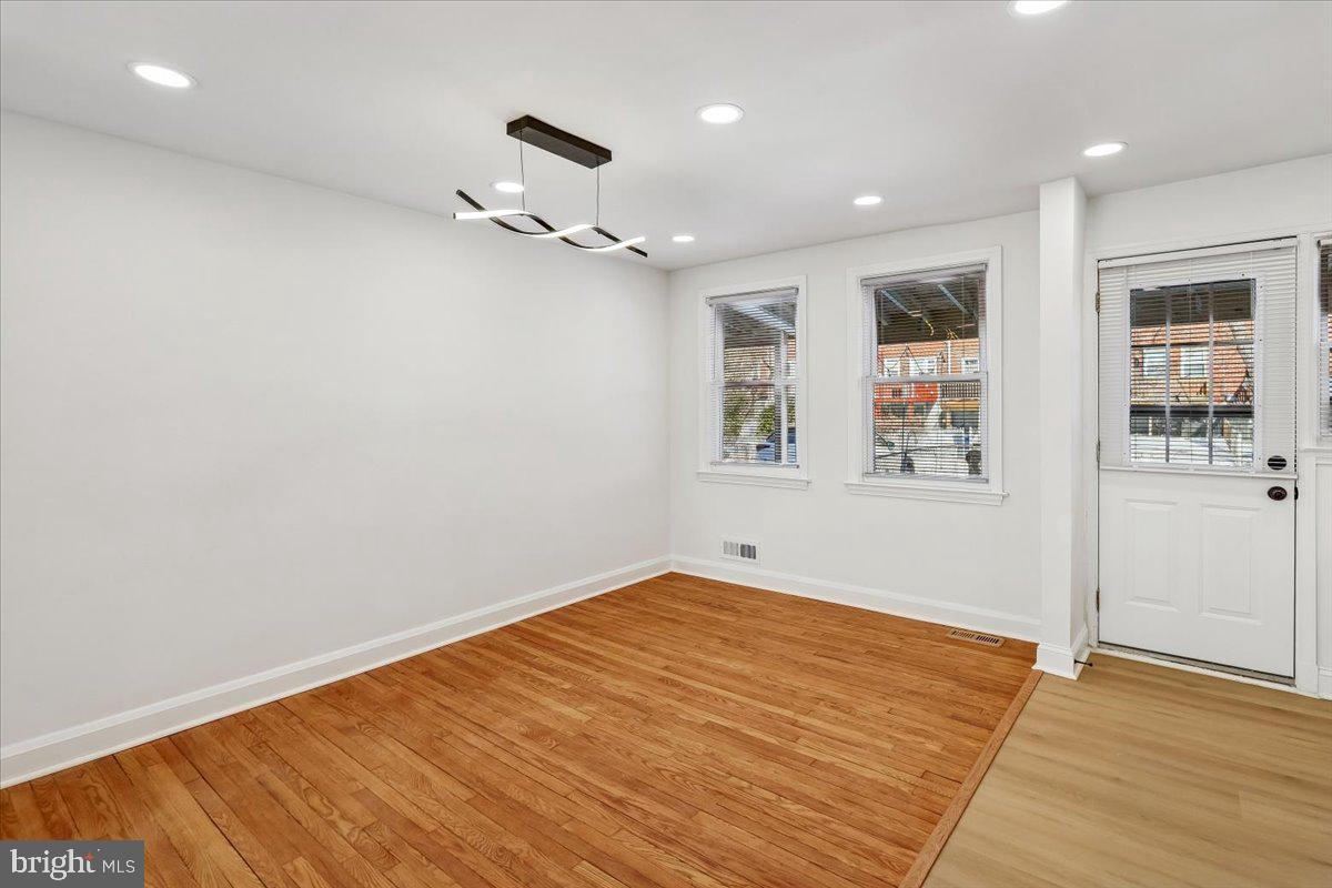 1616 Hardwick Road Towson, MD 21286 - Photo 8 of 36 wooden floor in an empty room with a window