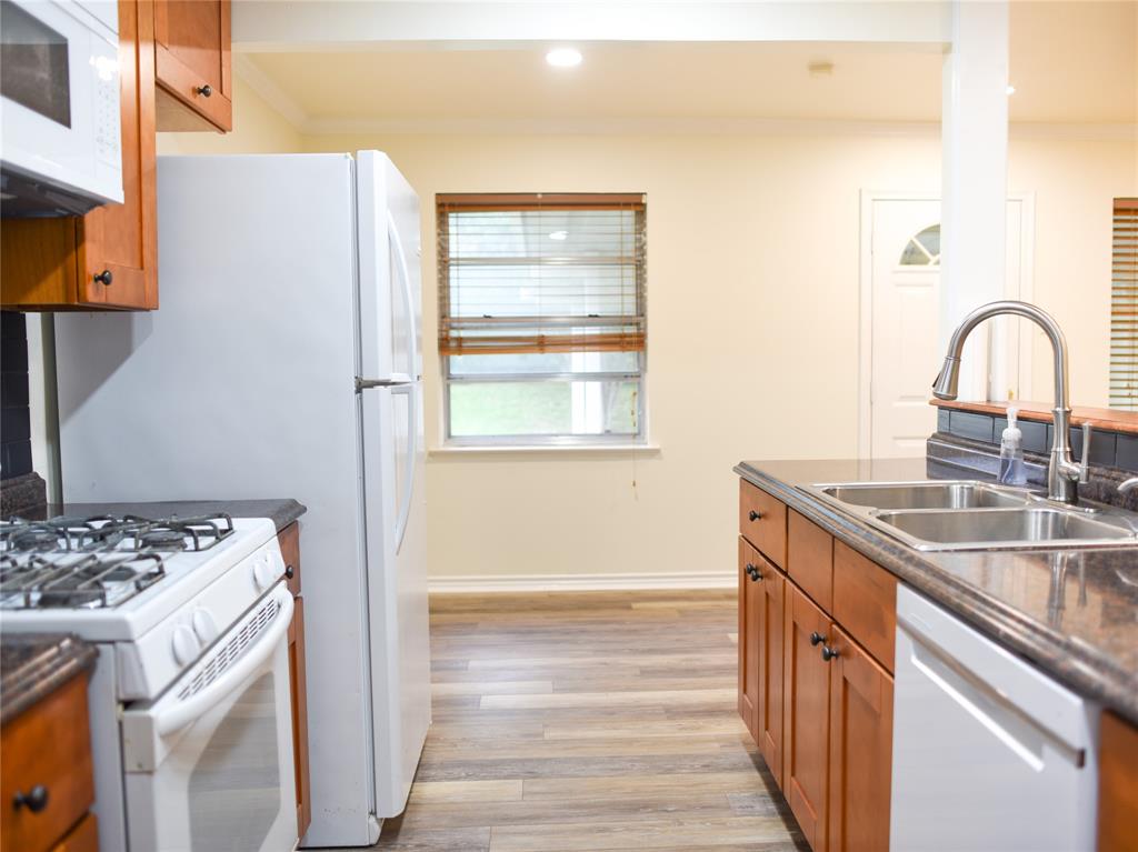 2325 North Ricketts Street Sherman, TX 75092 - Photo 13 of 28 a view of kitchen with a sink stove and refrigerator