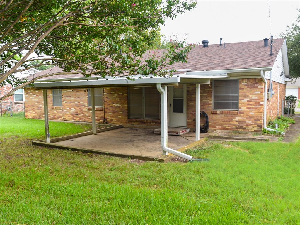 2325 North Ricketts Street Sherman, TX 75092 - Photo 25 of 28 a front view of a house with garden