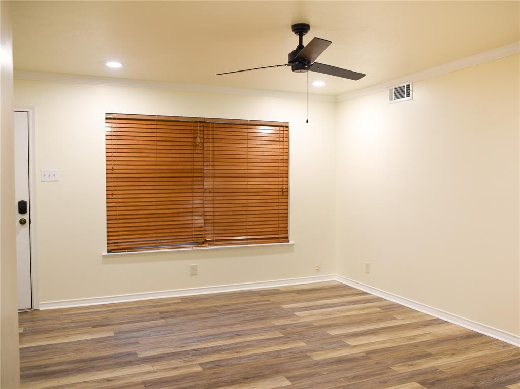 2325 North Ricketts Street Sherman, TX 75092 - Photo 4 of 28 a view of an empty room with wooden floor and a window