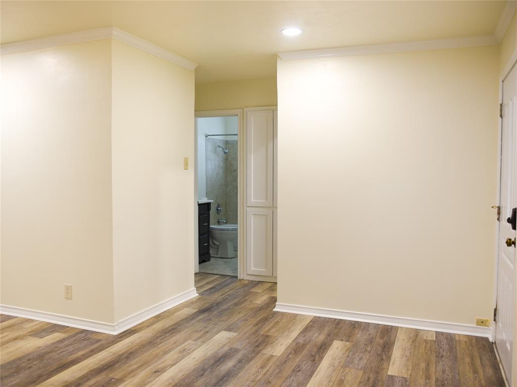 2325 North Ricketts Street Sherman, TX 75092 - Photo 7 of 28 a view of an empty room with wooden floor and closet