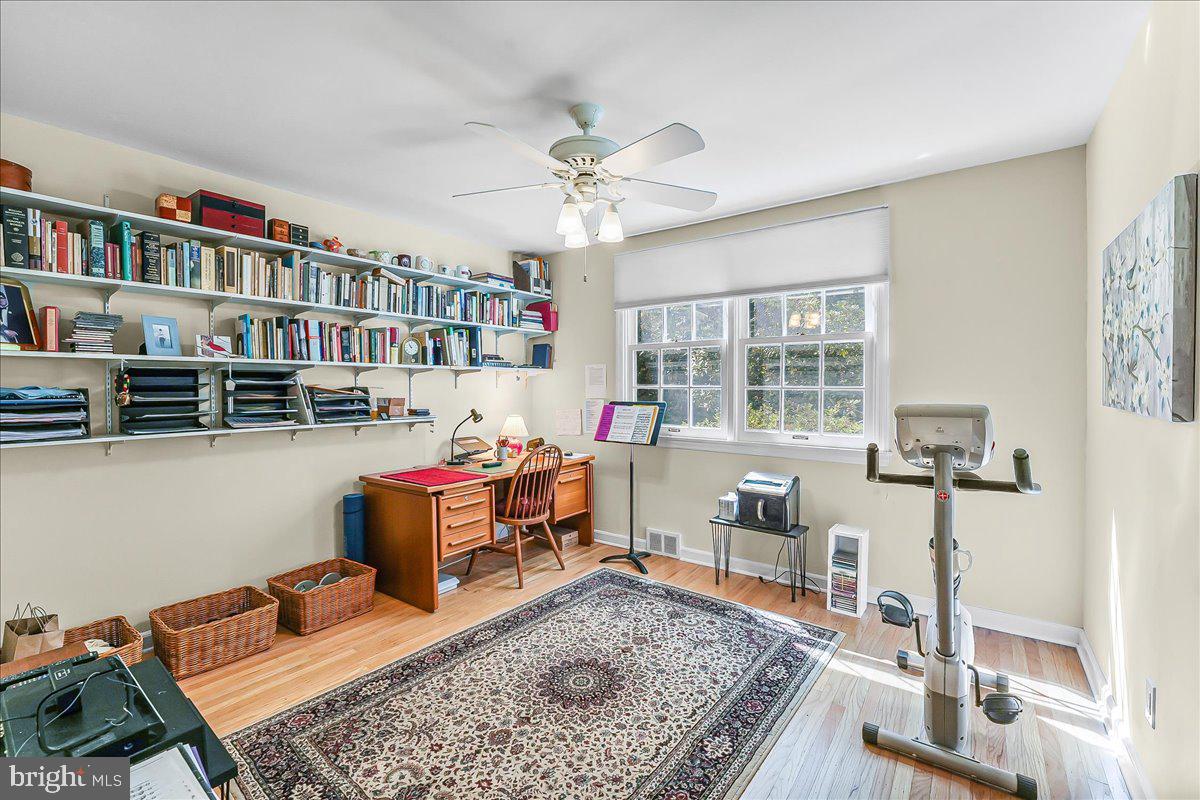 634 Knox Road Wayne, PA 19087 - Photo 24 of 40 a living room with furniture and a book shelf
