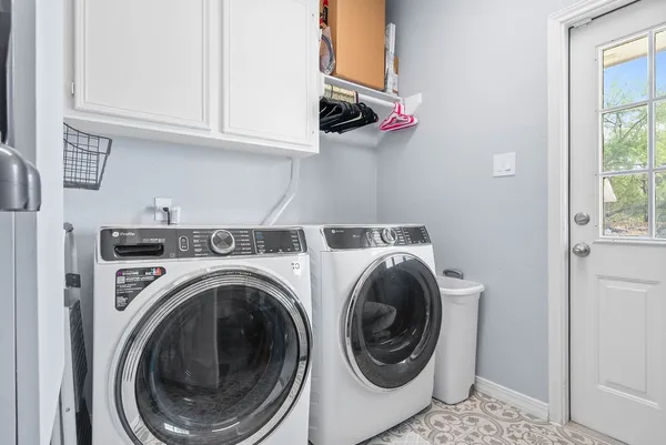 a utility room with dryer and washer