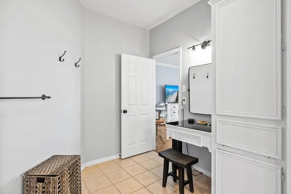 a kitchen with granite countertop a refrigerator and a stove top oven