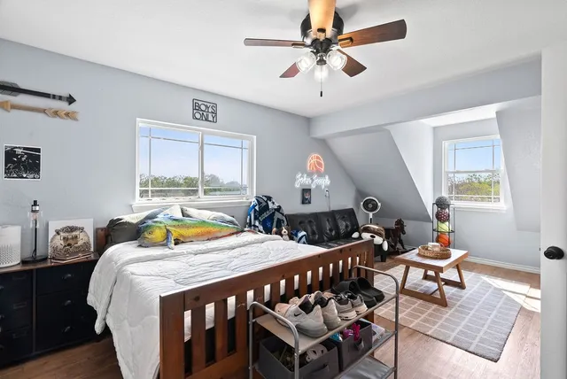 a bedroom with furniture and a window