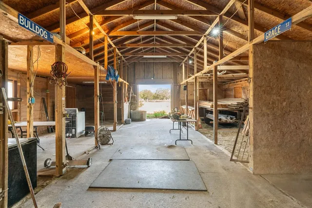 a view of a patio with table and chairs