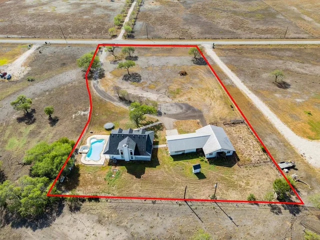 a view of swimming pool with sitting area