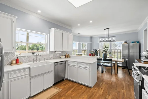 a kitchen with a sink and cabinets