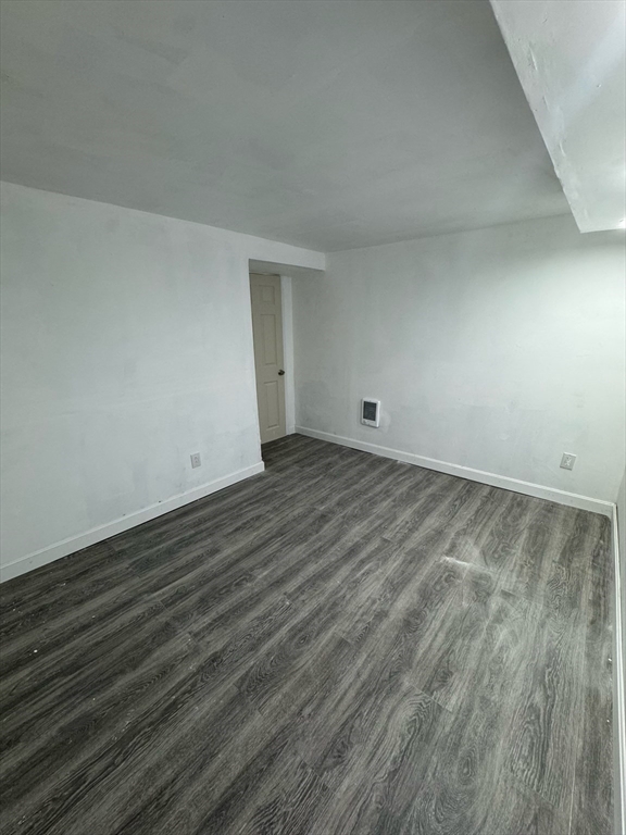 244 Wilbur Street, Unit 3 Fall River, MA 02724 - Photo 14 of 21 a view of an empty room with wooden floor