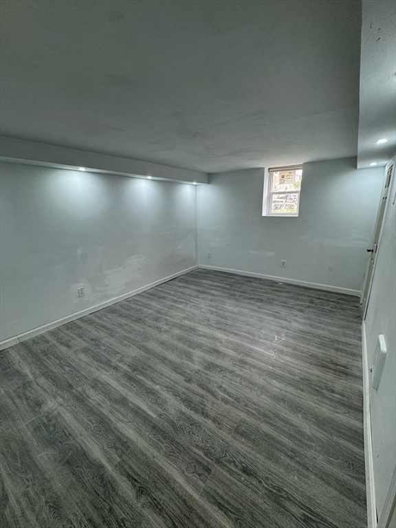 244 Wilbur Street, Unit 3 Fall River, MA 02724 - Photo 18 of 21 an empty room with wooden floor and windows