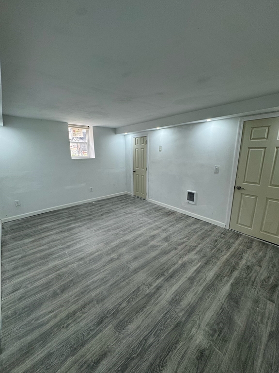 244 Wilbur Street, Unit 3 Fall River, MA 02724 - Photo 19 of 21 an empty room with wooden floor and windows