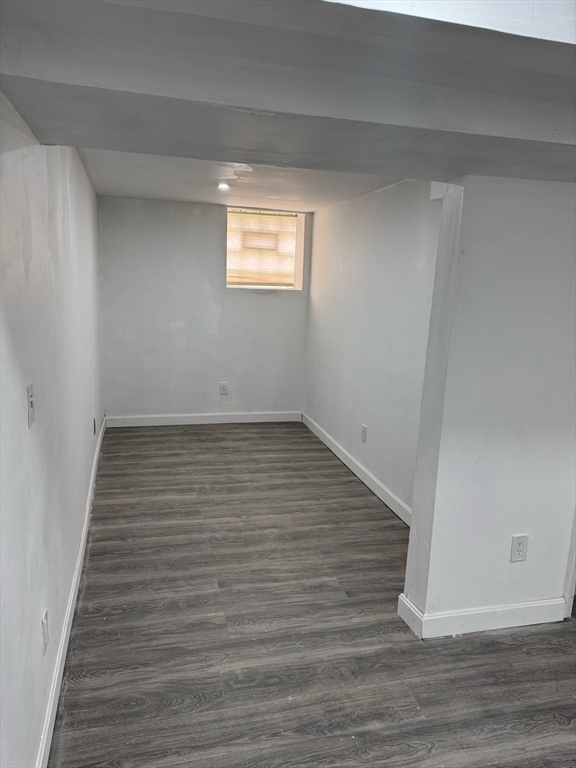 244 Wilbur Street, Unit 3 Fall River, MA 02724 - Photo 4 of 21 a view of an empty room with wooden floor and a window
