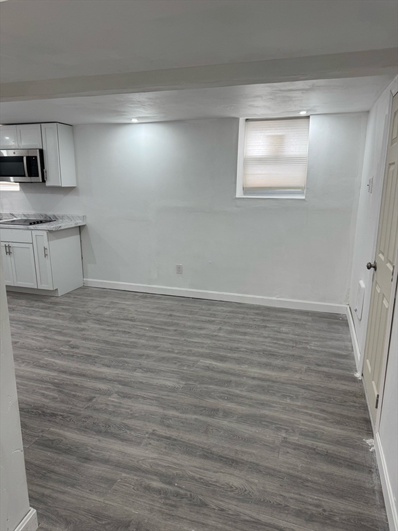 244 Wilbur Street, Unit 3 Fall River, MA 02724 - Photo 8 of 21 a view of a room with wooden floor and window