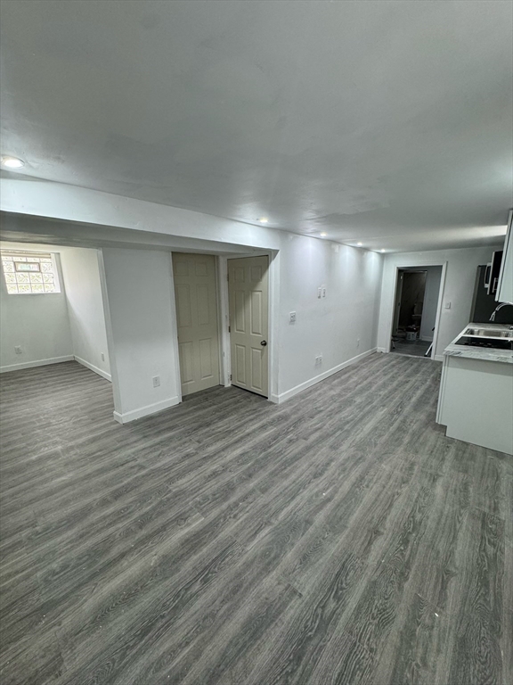 244 Wilbur Street, Unit 3 Fall River, MA 02724 - Photo 9 of 21 a view of a kitchen with wooden floor and electronic appliances