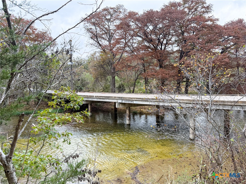 9751 River Road New Braunfels, TX 78132 - Photo 10 of 12 a view of a swimming pool with an outdoor seating