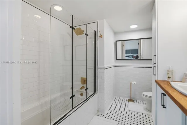 a bathroom with a shower and a sink