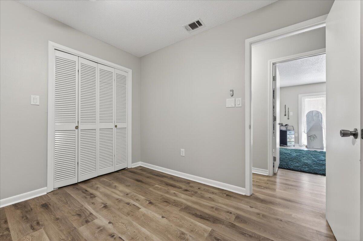 210 Shell Drive Crestview, FL 32536 - Photo 36 of 67 wooden floor in an empty room
