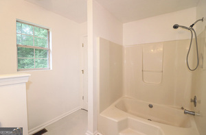 5851 Giles Road Lithonia, GA 30058 - Photo 11 of 15 a bathroom with a shower