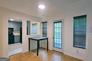 a view of a livingroom with furniture and wooden floor