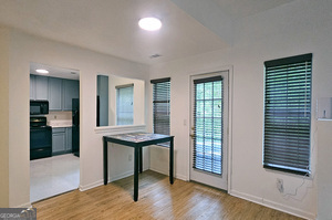 5851 Giles Road Lithonia, GA 30058 - Photo 5 of 15 a view of a livingroom with furniture and wooden floor
