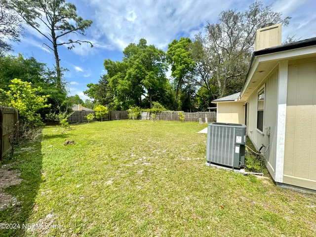 a view of a backyard with garden