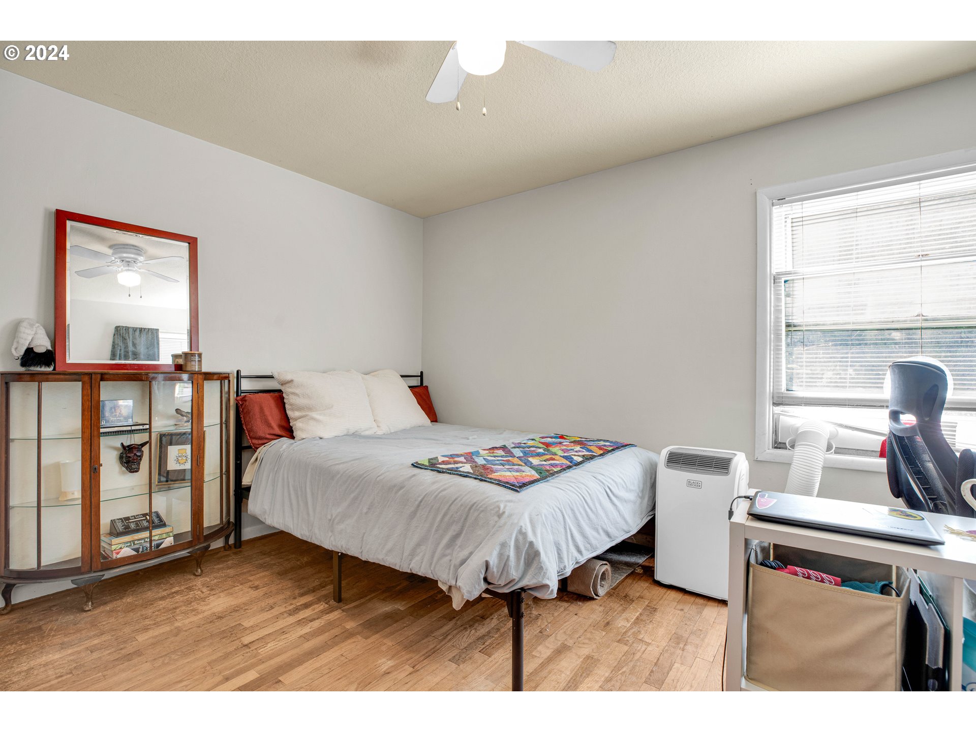 1315 North Russet Street Portland, OR 97217 - Photo 13 of 21 a bedroom with a bed and a large window