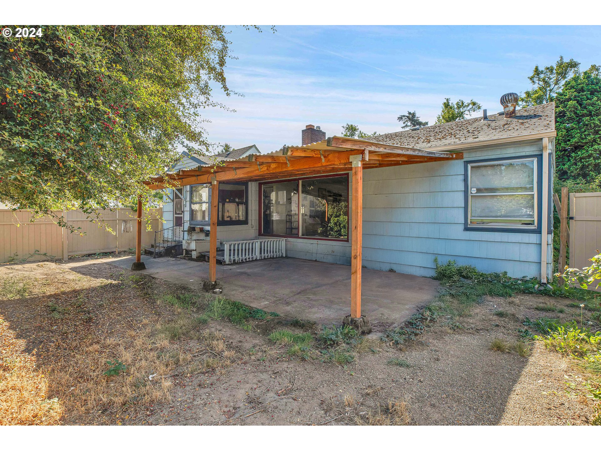 1315 North Russet Street Portland, OR 97217 - Photo 16 of 21 a view of a house with a yard and potted plants
