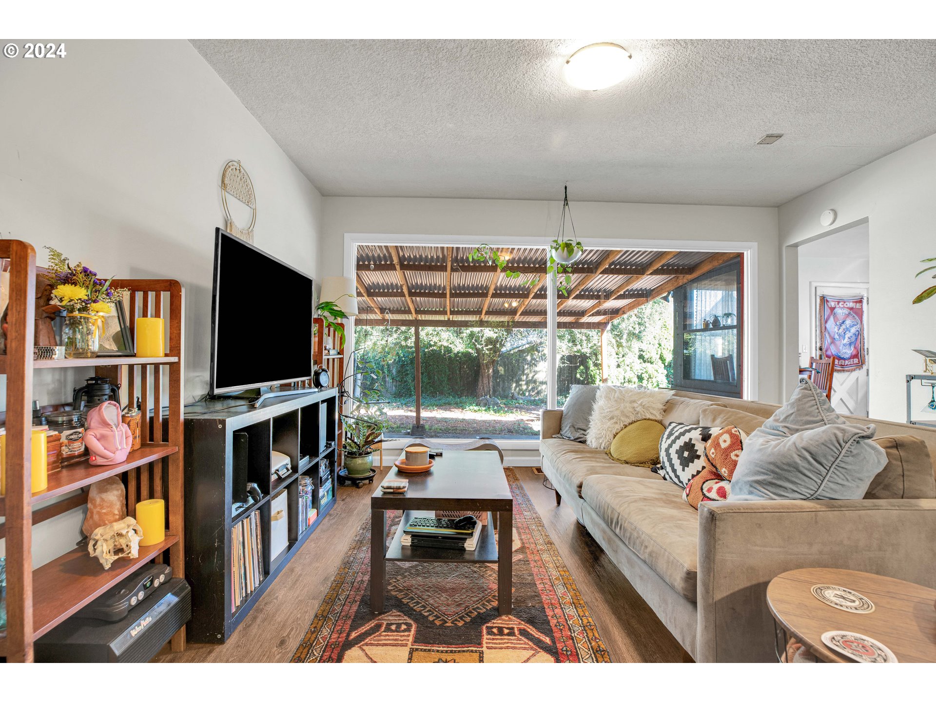 1315 North Russet Street Portland, OR 97217 - Photo 4 of 21 a living room with furniture and a flat screen tv