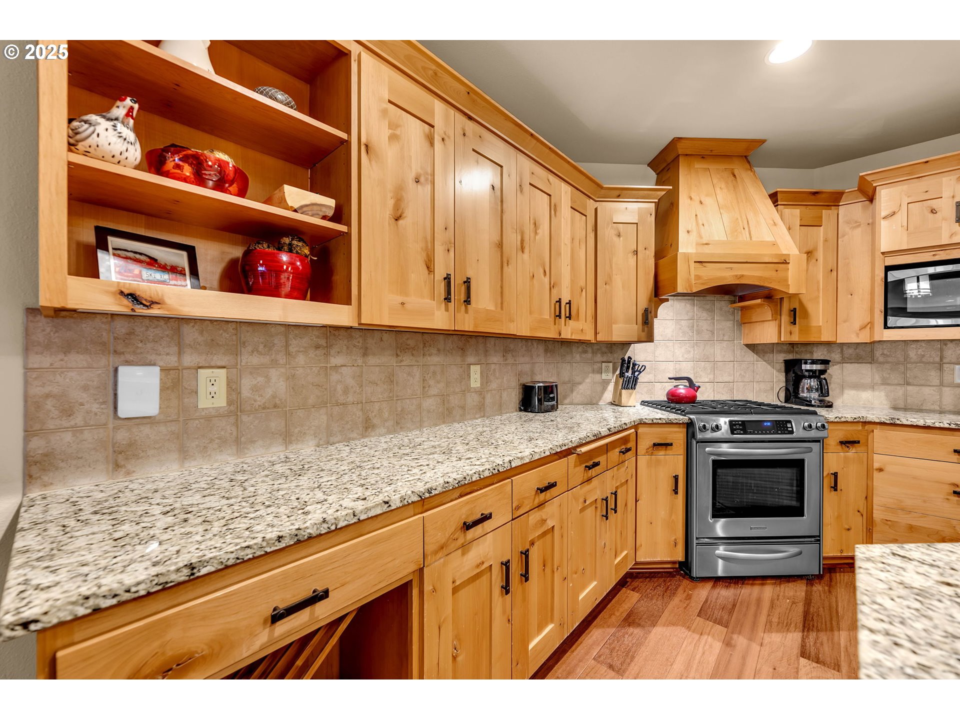 31254 East Collins Lake Road, Unit 22 Government Camp, OR 97028 - Photo 17 of 44 a kitchen with stainless steel appliances granite countertop a sink stove and cabinets