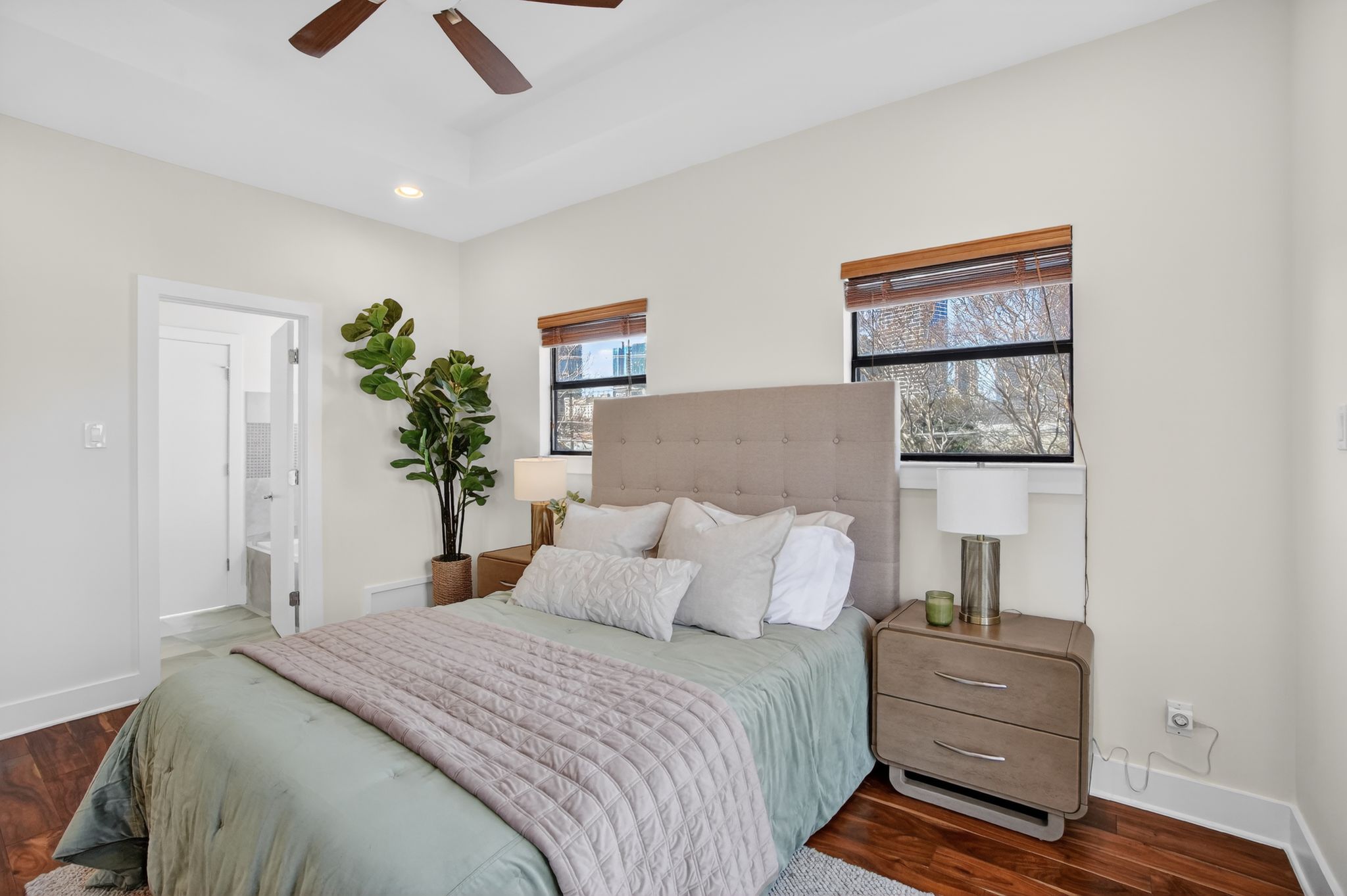 1203 East 2nd Street, Unit A Austin, TX 78702 - Photo 17 of 39 a bedroom with a bed and a painting on the wall