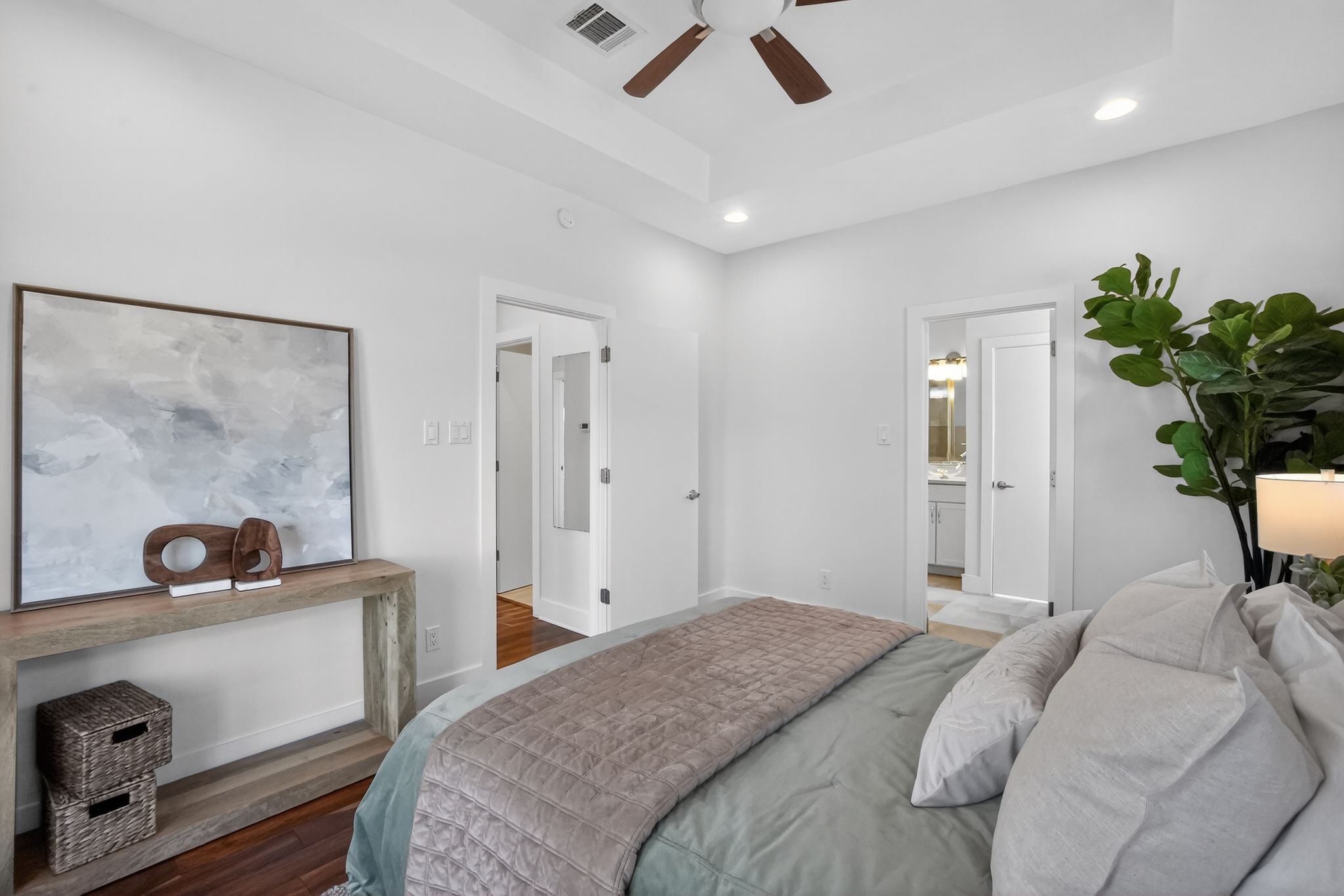 1203 East 2nd Street, Unit A Austin, TX 78702 - Photo 20 of 39 a bedroom with a bed and a large mirror