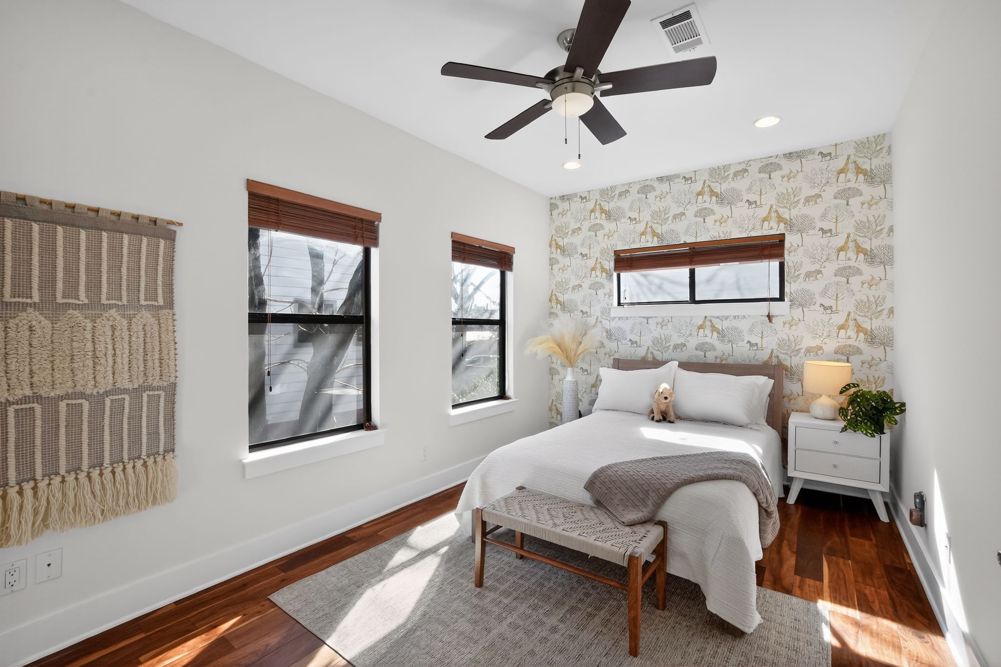 1203 East 2nd Street, Unit A Austin, TX 78702 - Photo 26 of 39 a bedroom with a bed furniture and paintings on the wall