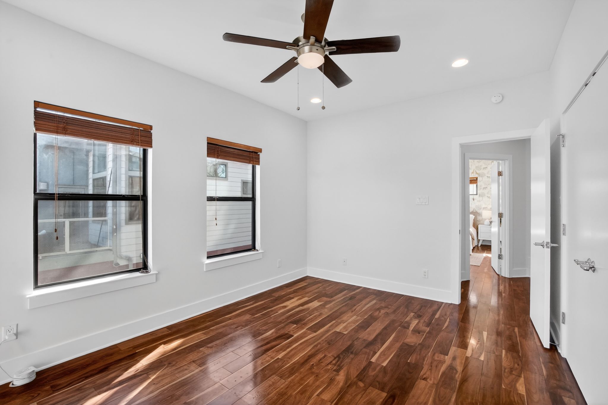 1203 East 2nd Street, Unit A Austin, TX 78702 - Photo 28 of 39 a view of empty room with wooden floor and fan