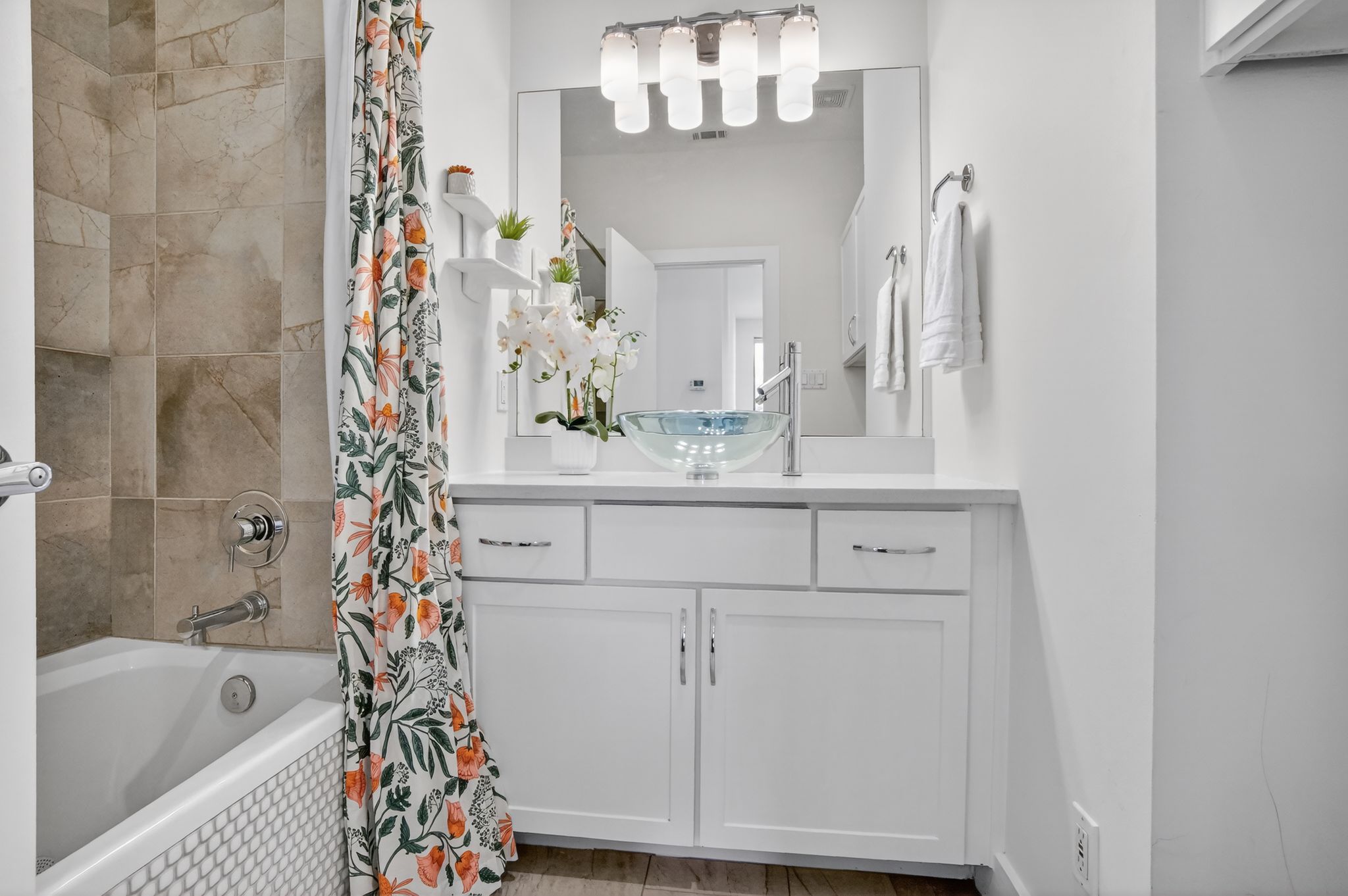 1203 East 2nd Street, Unit A Austin, TX 78702 - Photo 31 of 39 a bathroom with a bathtub sink vanity and mirror