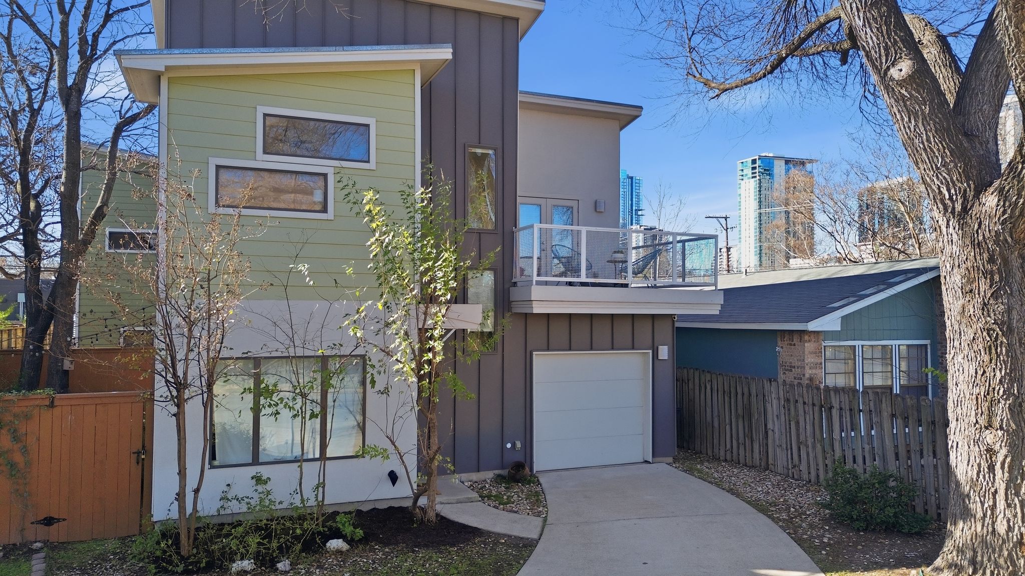 1203 East 2nd Street, Unit A Austin, TX 78702 - Photo 4 of 39 a front view of a house with a yard