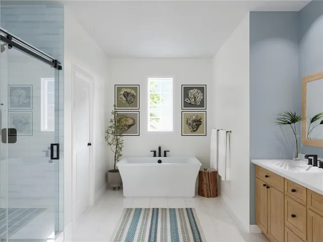 a en suite spacious bathroom with a double vanity sink a mirror and shower