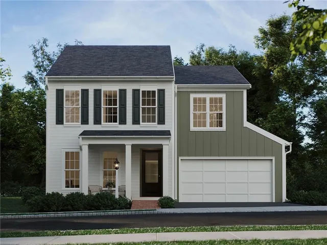 a view of a white house with large windows and a yard with plants and trees