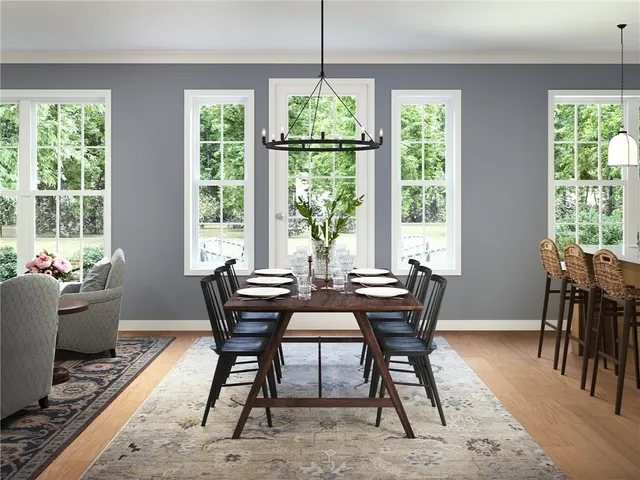 a view of a dining room with furniture window and outside view