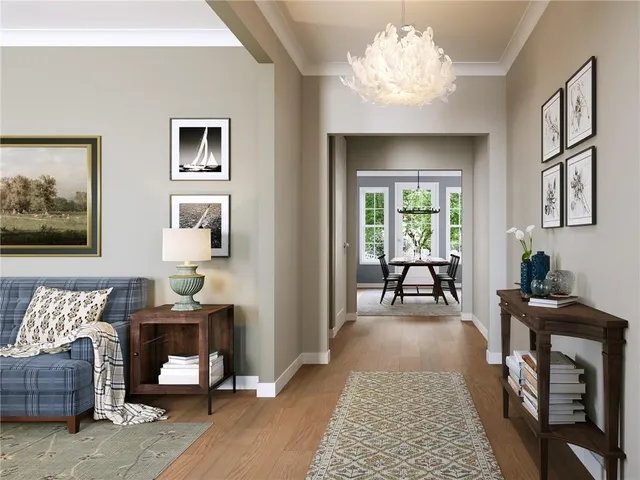 a living room with furniture and a chandelier