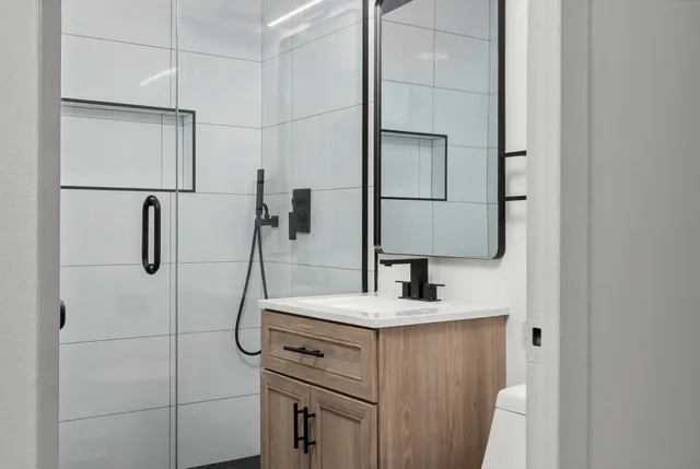 a bathroom with a sink and a mirror