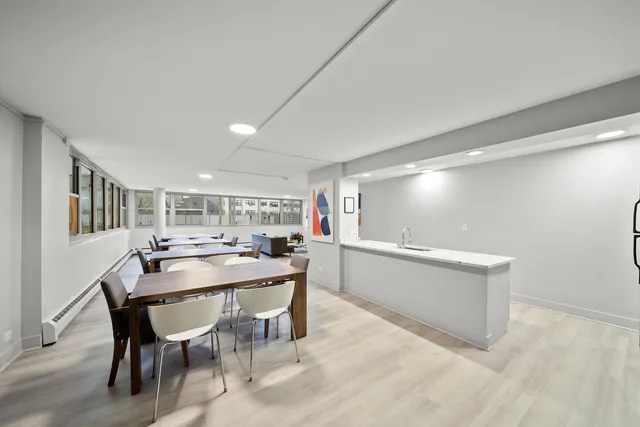 a dining room with furniture and window