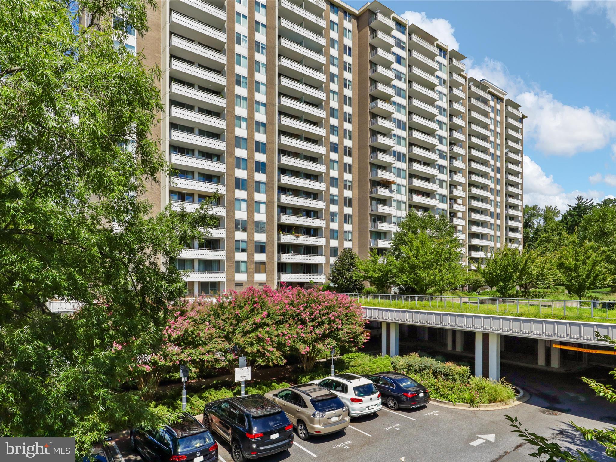 5101 River Road, Unit 1807 Bethesda, MD 20816 - Photo 1 of 32 a front view of a house with a yard