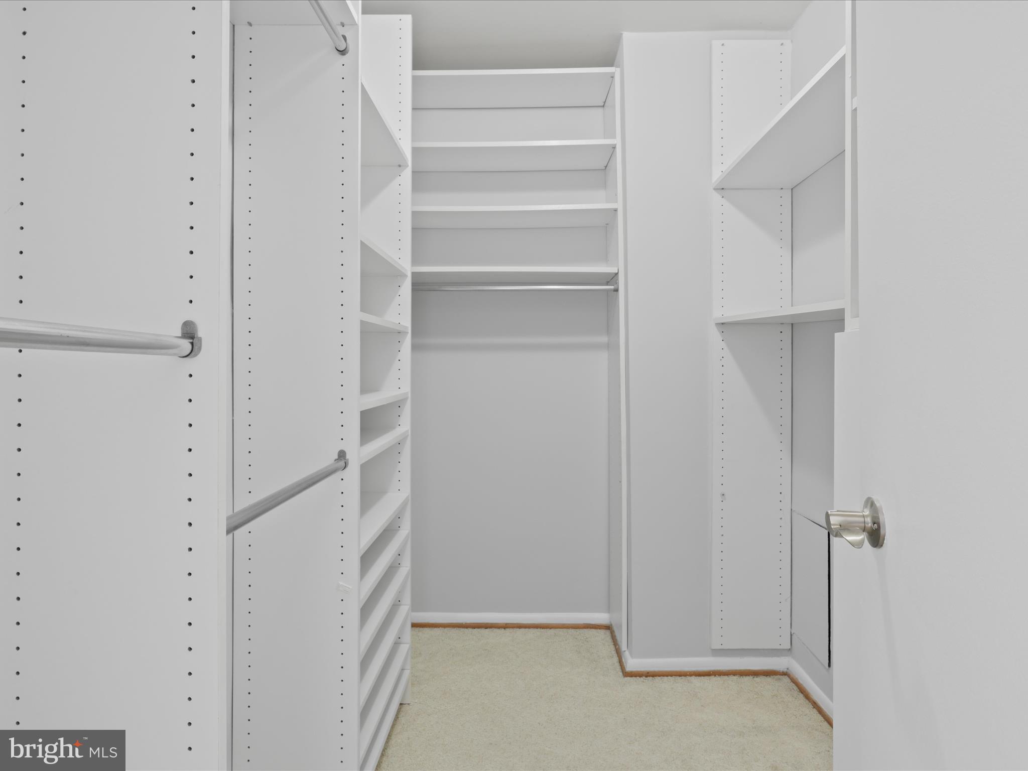 5101 River Road, Unit 1807 Bethesda, MD 20816 - Photo 19 of 32 a view of walk in closet with empty racks
