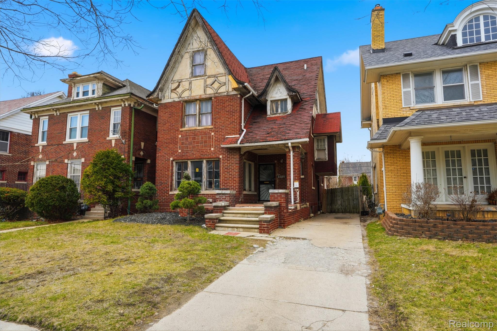 2500 Atkinson Street Detroit, MI 48206 - Photo 2 of 21 View of front of property with a chimney and brick siding