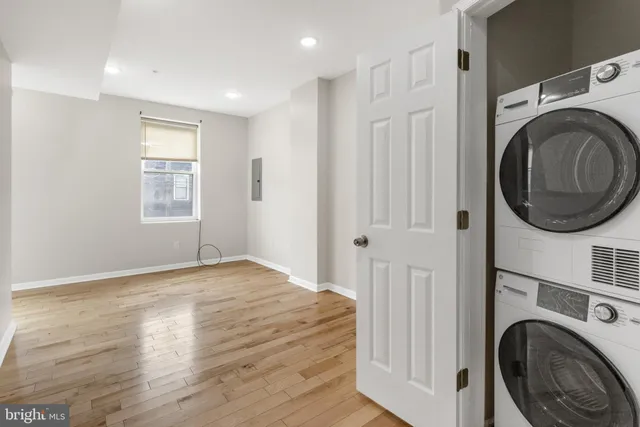 a view of livingroom with washer and dryer