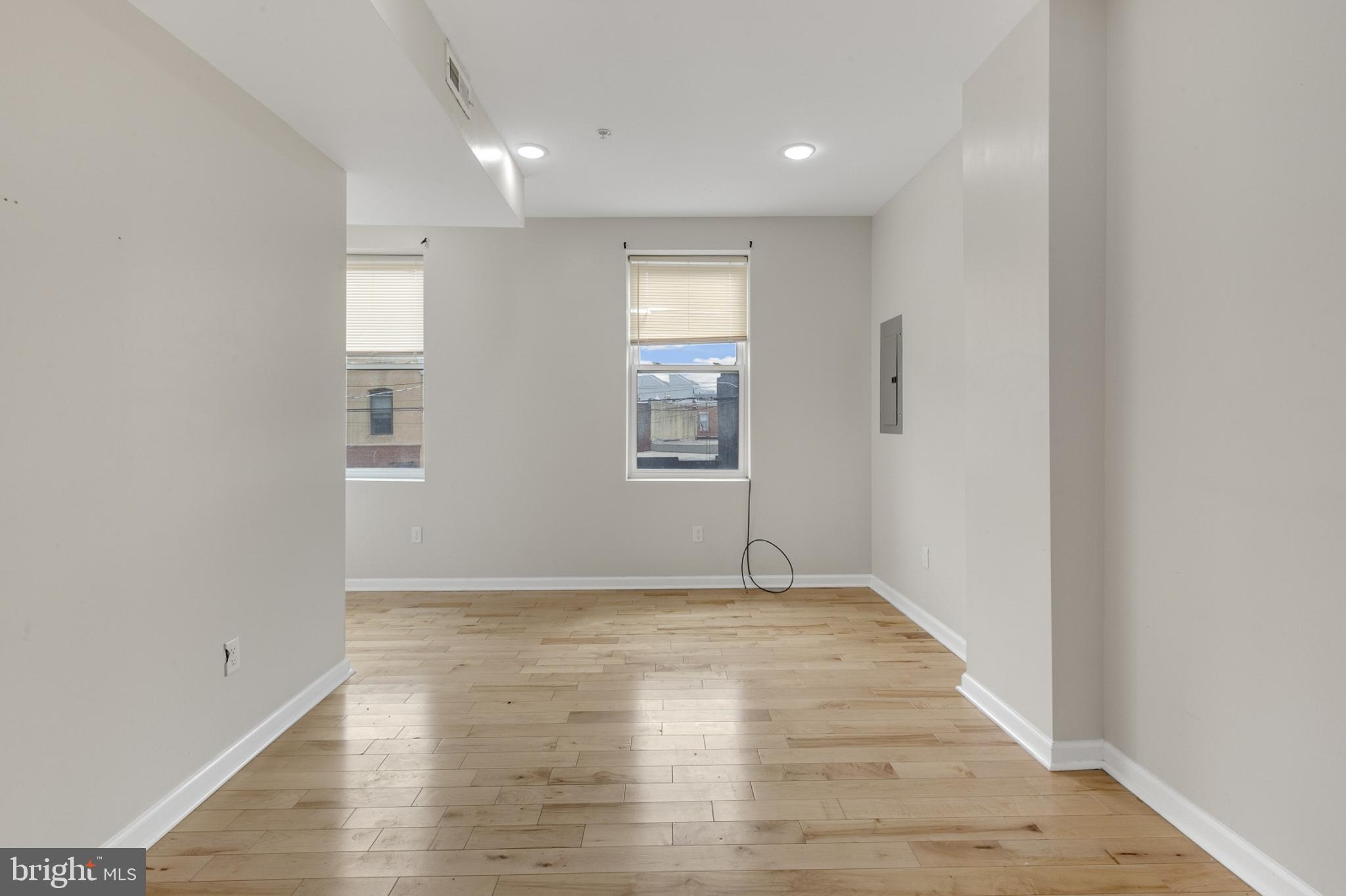 2604 Frankford Avenue, Unit 3 Philadelphia, PA 19125 - Photo 6 of 13 a view of empty room with wooden floor and fan