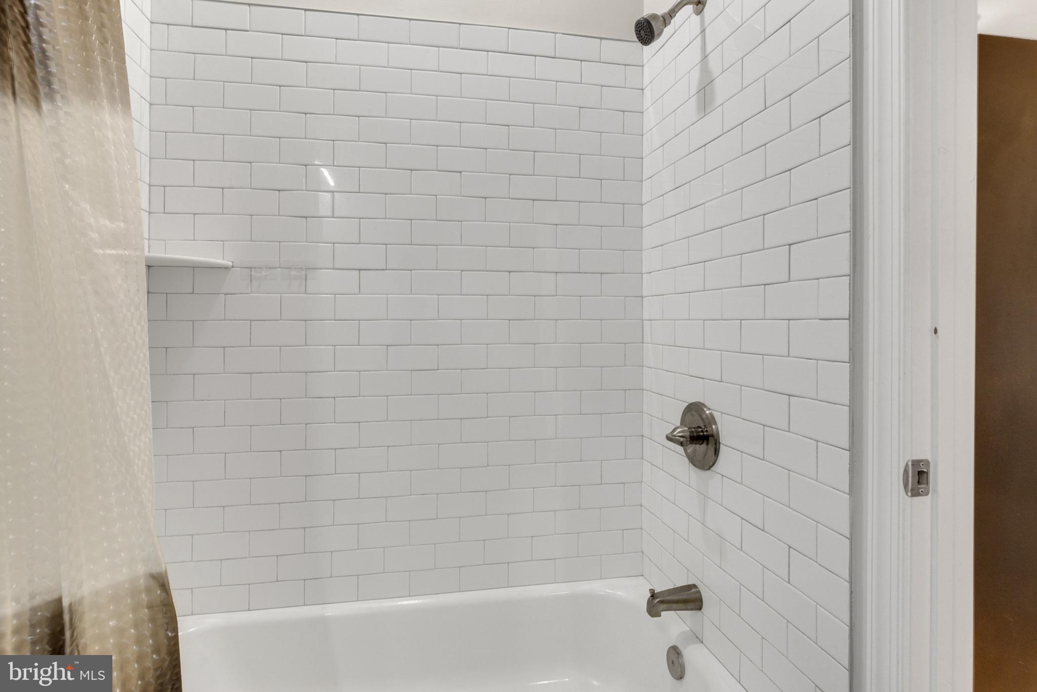 2604 Frankford Avenue, Unit 3 Philadelphia, PA 19125 - Photo 9 of 13 a bathroom with a bathtub