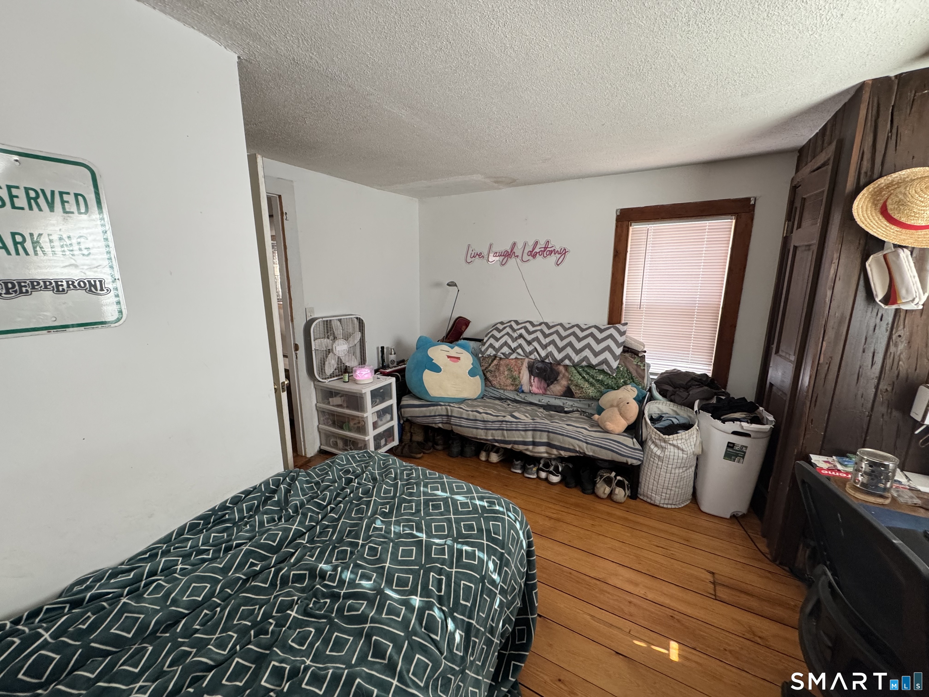 527 Worthington Ridge Berlin, CT 06037 - Photo 17 of 34 a bedroom with a bed and wooden floor