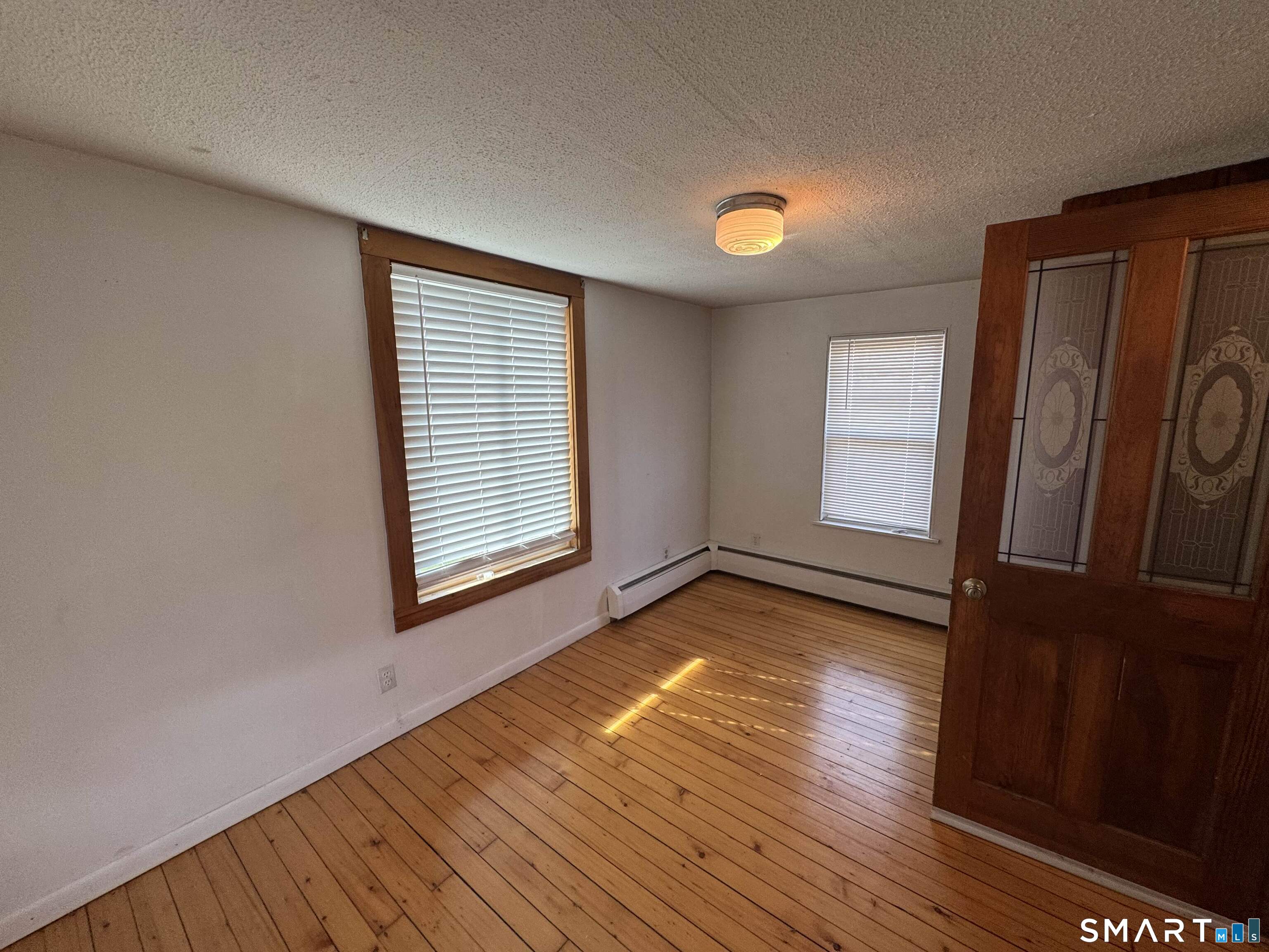 527 Worthington Ridge Berlin, CT 06037 - Photo 19 of 34 a view of a room with wooden floor and window