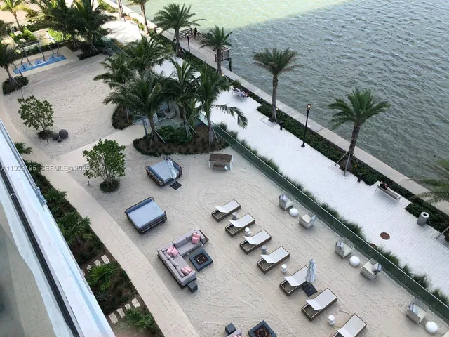 a white table sitting in a flower room with wooden floor